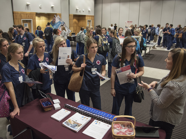 Nursing students, from left, Olivia Fulton, Jordan Jackson, Logan Berry, Regan Crain and Ashley Weaver discuss job openings with Jennifer Randazzo, a human resources recruiter for St.Tammany Parish Hospital in Covington, Louisiana.