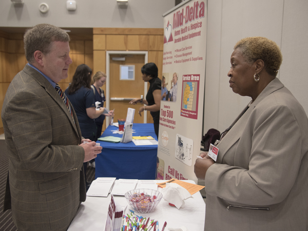 Harrington and Liz Johnson, vice president of human resources at Mid-Delta Home Health Hospice, discuss the large turnout for the fair.