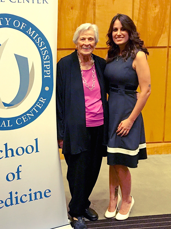 In this July 21, 2016, file photo UMMC nursing legend Bebe Richardson, left, congratulates her granddaughter Lewis, who was one of more than two dozen senior medical students inducted into the Gold Humanism Honor Society.