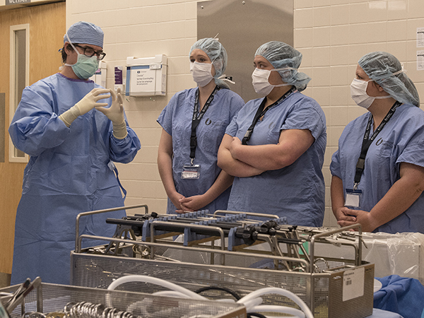 Dr. Truman M. Earl, associate professor of transplant surgery, describes laparoscopic gallbladder surgery to Blaylock, second from left, Howell, second from right, and Price.
