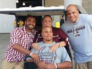 Prescott, center, pauses for a photo with his mom, Peggy, and brothers, Tad, left and, Jace, right, during her battle with colon cancer.