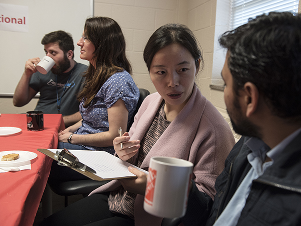 Trainees from around the world, including, from left, Tarek Ibrahim of Lebanon, Marija Kuna of Croatia, Dr. Lili Shi of China and Dr. Parash Parajuli of Nepal, gather for coffee and conversation.