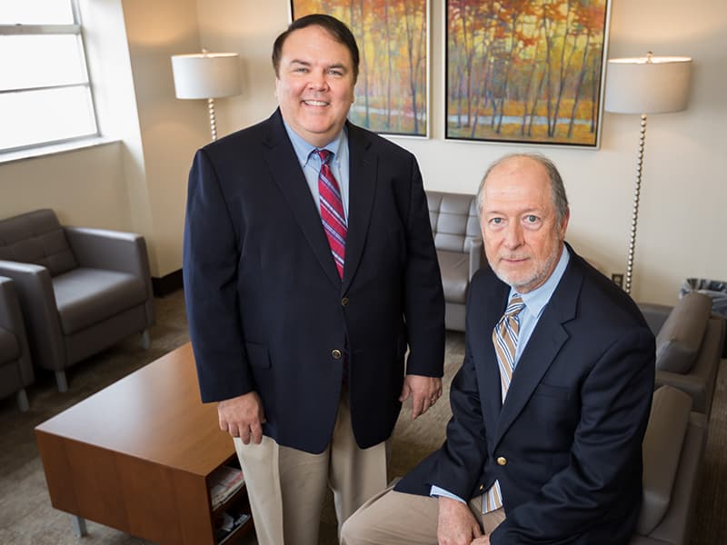 Dr. Mark Ladner, left, associate professor of psychiatry, and Dr. Jefferson Parker, associate professor of psychiatry, are on the four-person team offering new alcohol assessment and treatment services.