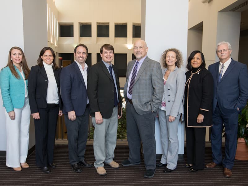 Gold medallion winners, starting second from left: Dr. Jennifer Sasser, Dr. Kevin Freeman, Dr. Lee Bidwell, Dr. Ray Grill, Dr. Lique Coolen and Dr. Bettina Beech, with Musshafen and Summers. Not pictured: Dr. Robert Annett.