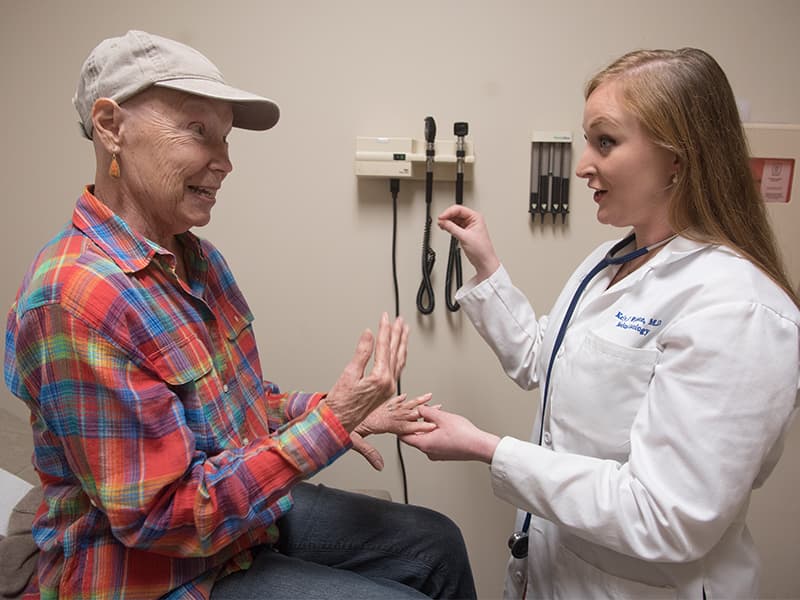 Ann Anderson of Brandon, left, an ovarian cancer patient, receives an exam from Dr. Kelly Wilkinson, medical oncologist and treatment team member, following a recent round of chemotherapy.