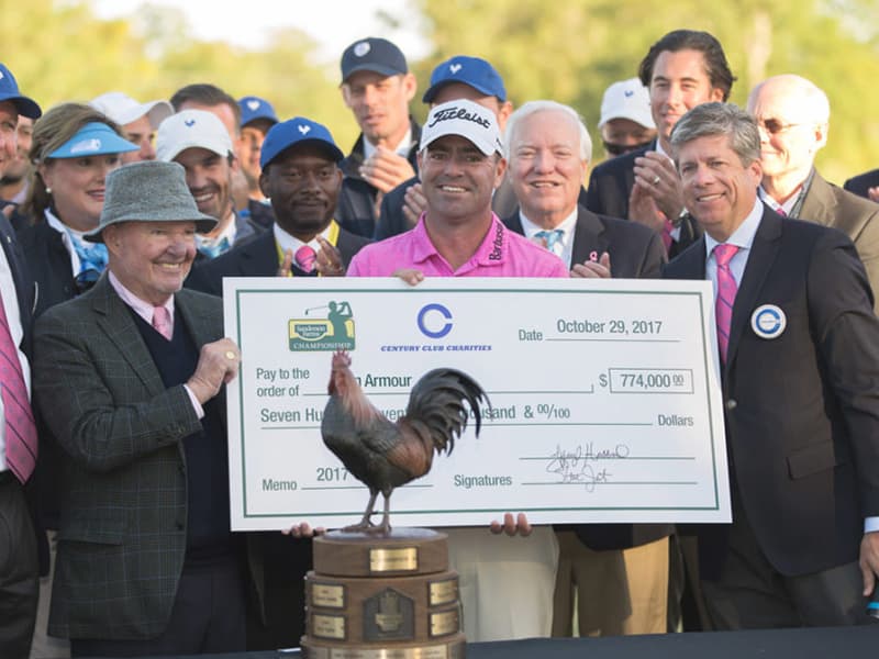 Ryan Armour, center, Sanderson Farms Championship winner, receives congratulations from Joe Sanderson Jr., left, Sanderson Farms CEO and board chair, and Steve Jent, executive director of the tournament.