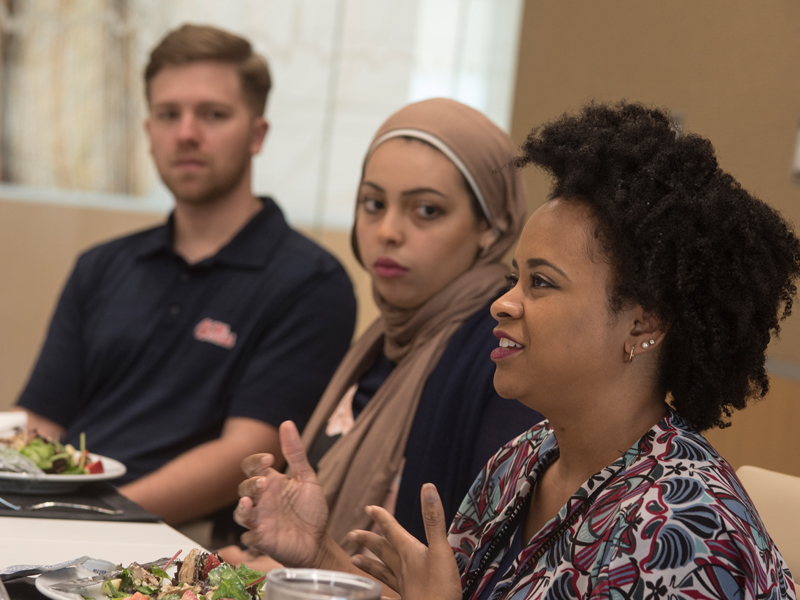 Acosta took time to lunch with students from the Associated Student Body diversity committee. From the right are medical students Kandice Bailey and Yassmin Hegazy and nursing student William Thomas.