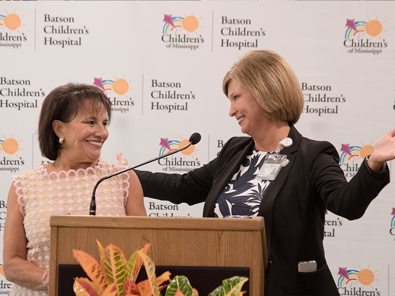 Dr. LouAnn Woodward, UMMC vice chancellor for health affairs and dean of the School of Medicine, thanks Friends of Children’s Hospital board chair Sara Ray for the nonprofit group’s $20 million pledge to the Campaign for Children’s of Mississippi in August 2016.