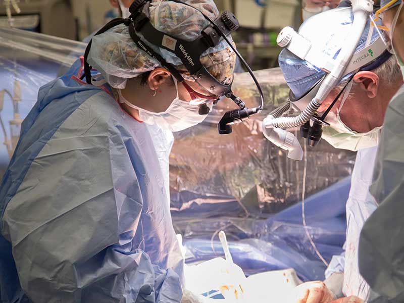 Transplant surgeon Dr. Hannah Copeland, left, performs a heart surgery in fall 2017.