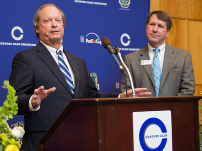 Sidney Allen, board chairman of Friends of Children's Hospital, thanks Century Club Charities for their donation of $1.2 million from the Sanderson Farms Championship. Looking on is Jeff Hubbard, Century Club Charities president.