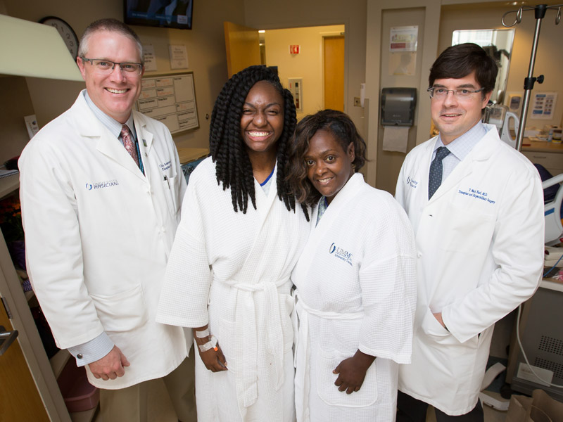 Dr. Christopher Anderson, left, and Dr. Mark Earl, right, performed the Medical Center's first split liver transplant in April 2017 in which patients Bettina Dixon, second from left, and Roda Barnes shared a donor liver. Joe Ellis/ UMMC Communications
