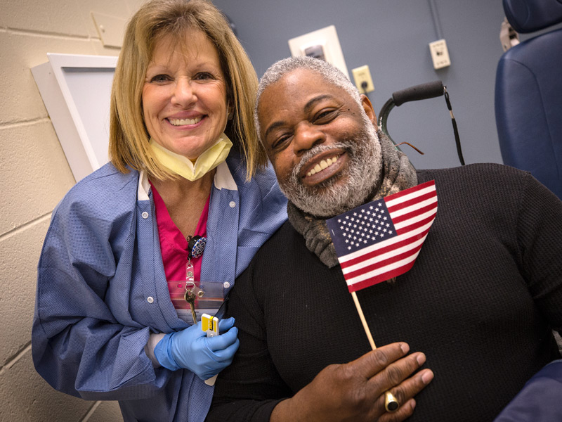Donna Edwards, dental assistant, and Curtis Porter, U.S. Army veteran, are all smiles after his dental visit at the 2018 Dental Mission Week hosted by the School of Dentistry at the University of Mississippi Medical Center.