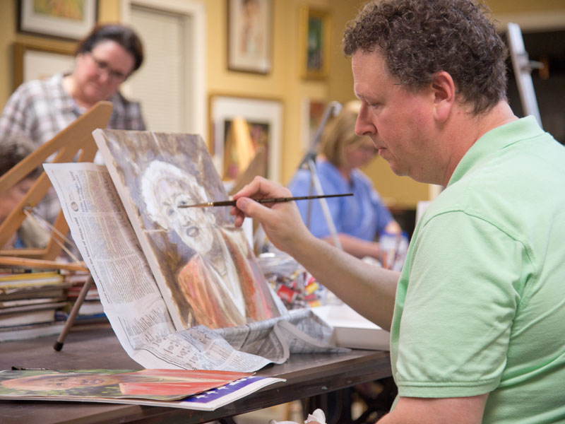 McHann has finished the rough underpainting and is now adding the color to the portrait of White's mother.