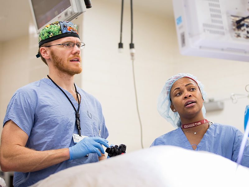 Dr. Jacob Moremen prepares to insert an esophageal scope as part of the POEM procedure while Angela Sloan, scrub tech, assists.
