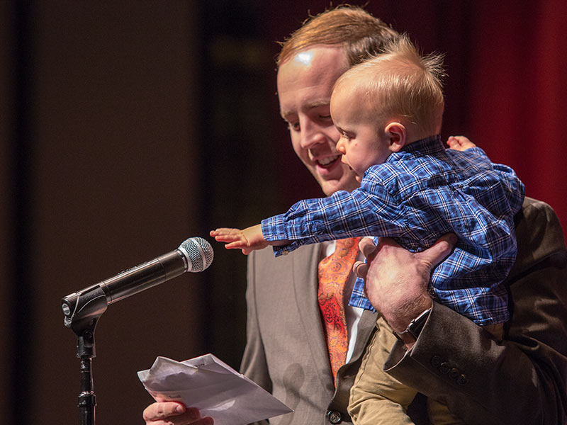 Paul Russell Roberts reveals he has captured a match in medicine-preliminary/radiology oncology at UMMC, while his son, Owen, tries to capture the microphone.