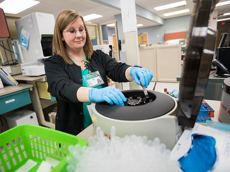 Phlebotomist Marion Grantham runs a blood specimen in the laboratory at UMMC Grenada. Ensuring patients suffer no harm caused by incorrect specimen testing is just one facet of the Medical Center's Chasing Zero error prevention campaign.