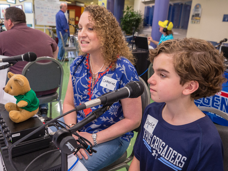 Catherine Faulk and her son, Charlie, a Batson Children's Hospital patient, tell their story during the Mississippi Miracles Radiothon Feb. 28.