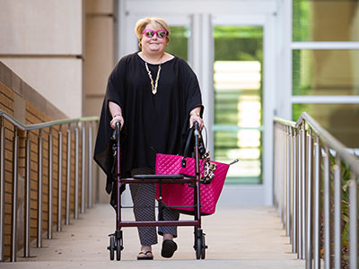 Tammy Dempsey, director of community engagement and service learning in the Office of Academic Affairs, walks to and from the office instead of riding the bus.