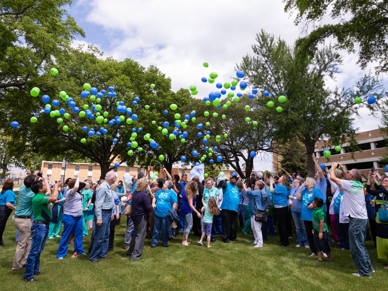 Transplant recipients, organ donor families, University Transplant staff and employees of the Mississippi Organ Recovery Agency release balloons at the 2018 Legacy Lap.