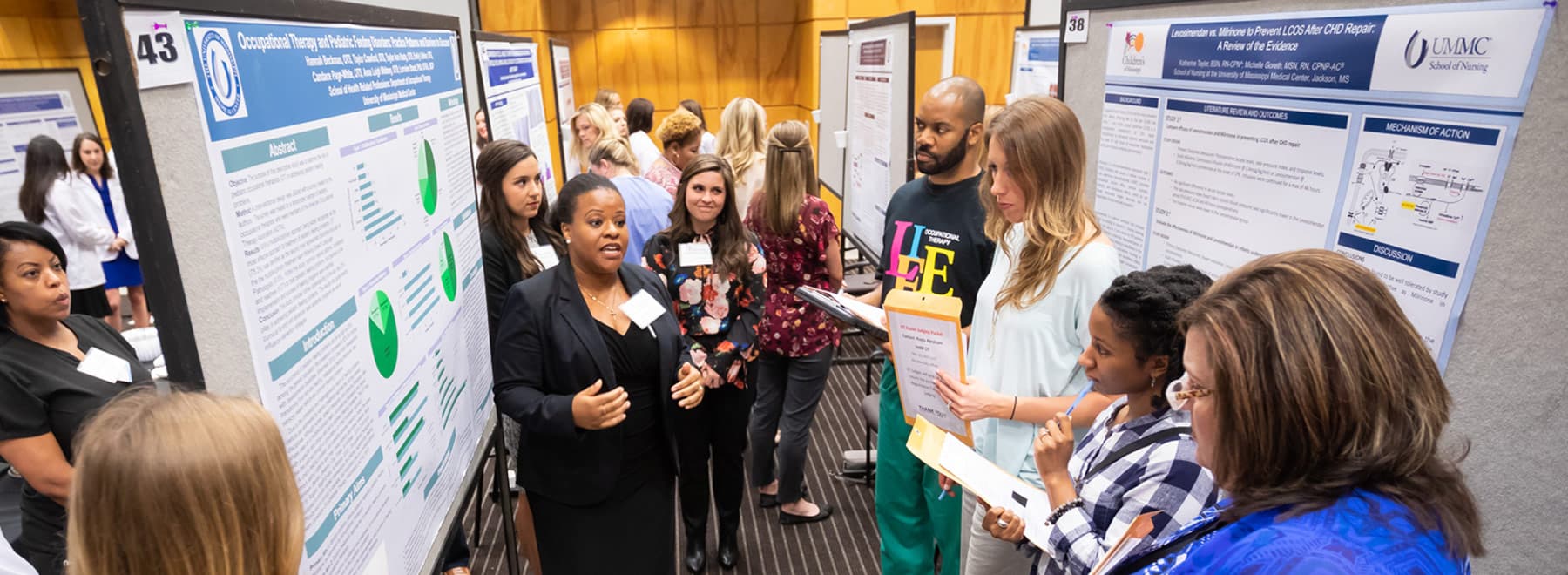 Candace Page-White, center, presents her team's research poster to judges.