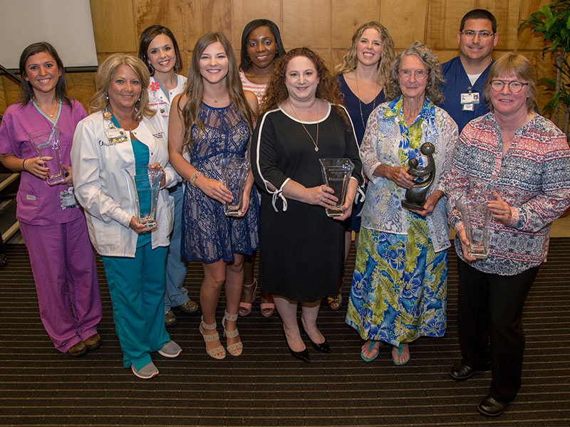 Winners of Excellence in Nursing Awards are, from left, Brittany Ransom, Cissy Lee, Alice Chaney Herndon, Lillie McCoy, Jasmine Moore, Michelle Goreth, Sarah Gilbert, Martha Cooley, Neal Loving and Teresa Fink.