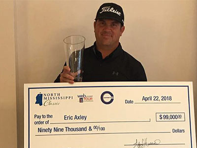 Web.com TOUR golfer Eric Axley shows his trophy and winnings from the inaugural North Mississippi Classic.
