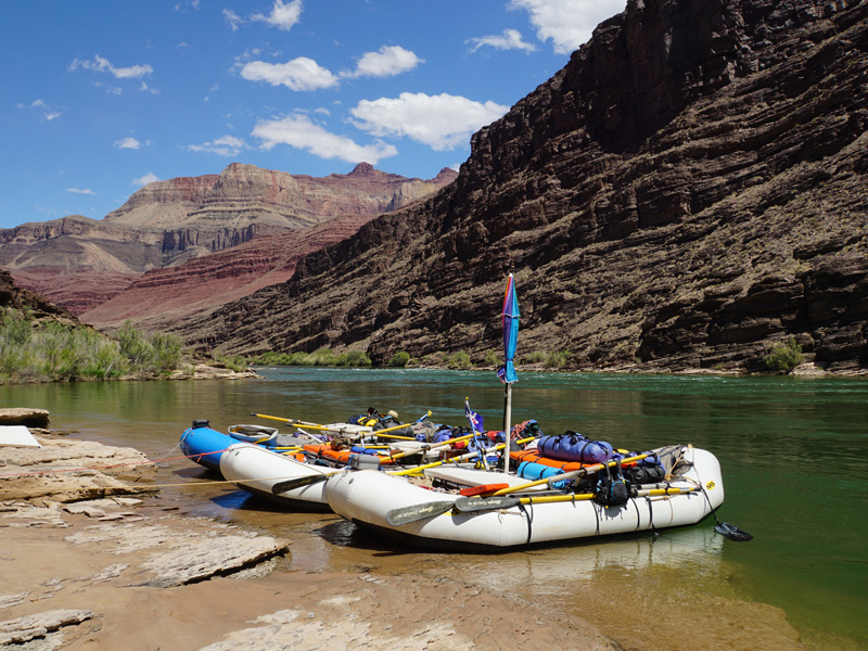 Secured on the beach, the rafts are packed with First Aid supplies, a water purifier, spare oars and more.