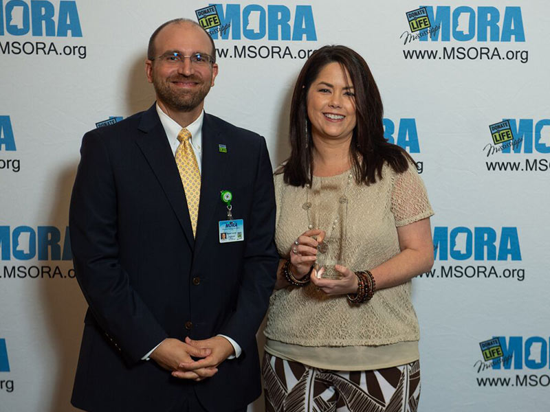 Michelle Crawford, abdominal transplant coordinator at UMMC Grenada, is  winner of MORA's Hospital Leadership of the Year Award. She's pictured with Russell Touchet, MORA's chief business officer.