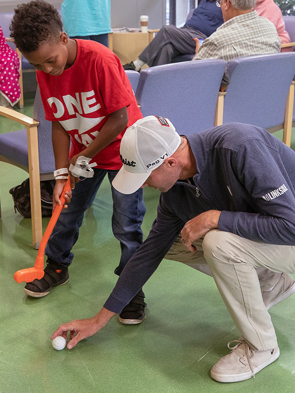 Professional golfer Nicholas Lindheim gives Philip Wimley of Natchez a golf lesson at Batson.