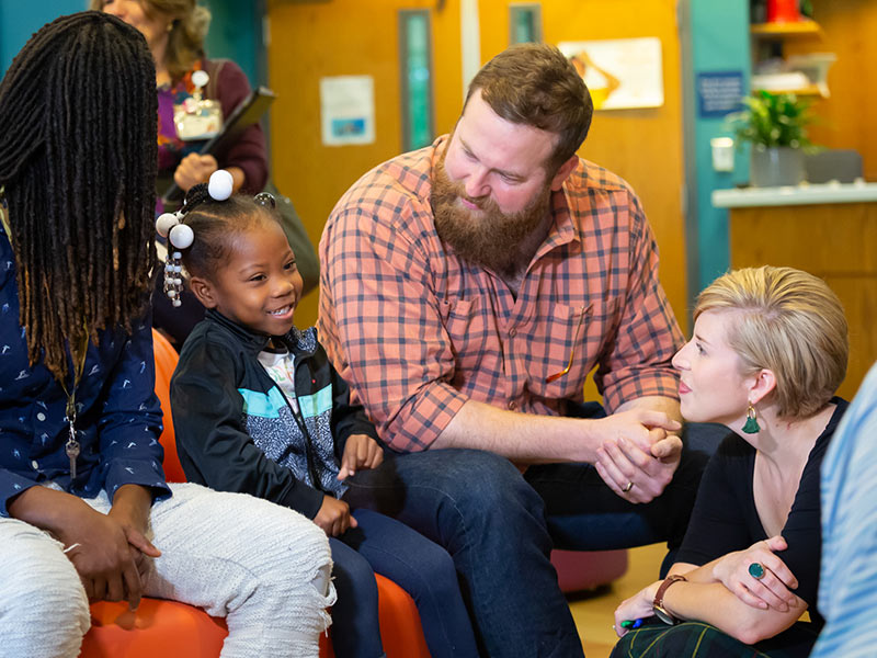 Ziniyah Booth of Jackson visits with HGTV "Hometown" hosts Ben and Erin Napier during their tour of the Children's Cancer Center.