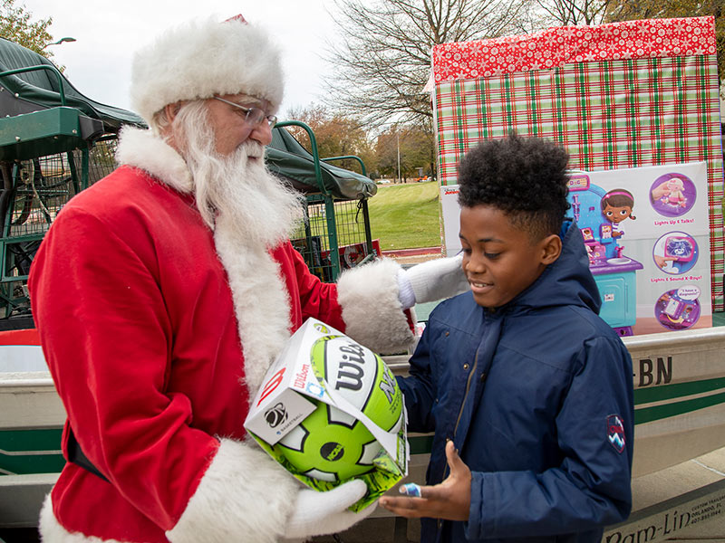 Batson Children's Hospital patient Zamari Lanier of Meridian gets a gift from Santa.