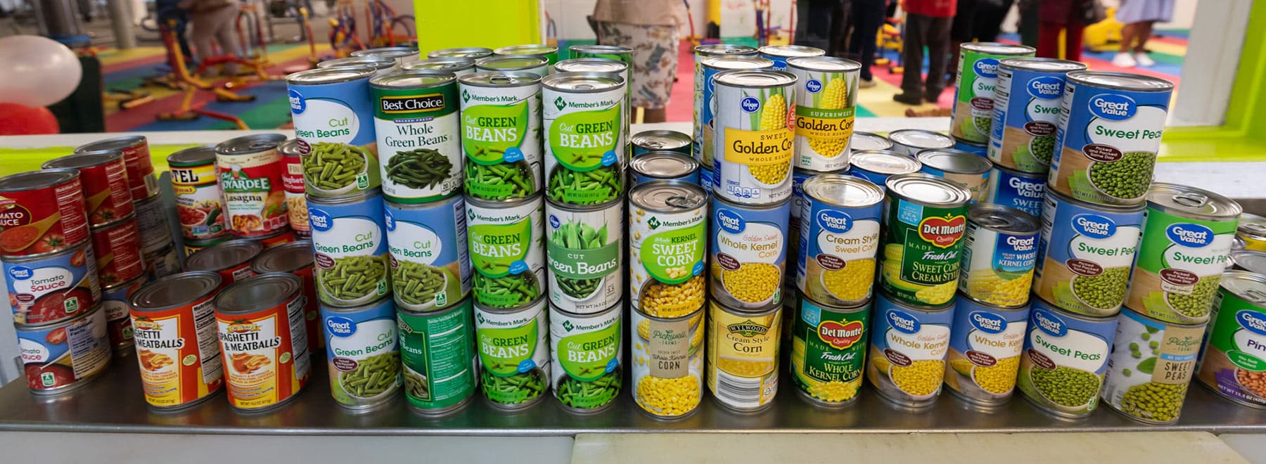 Cans of food on the shelf of the EversCare food pantry