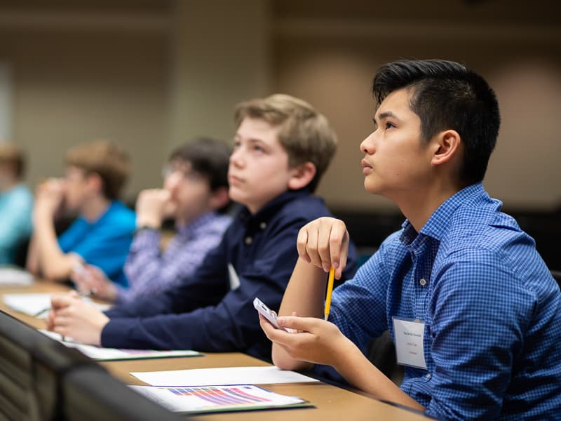 Andy Tran, right, and Joshua Bowman, left, prepare to answer the question on the screen as part of the "You Be the Chemist" competition.
