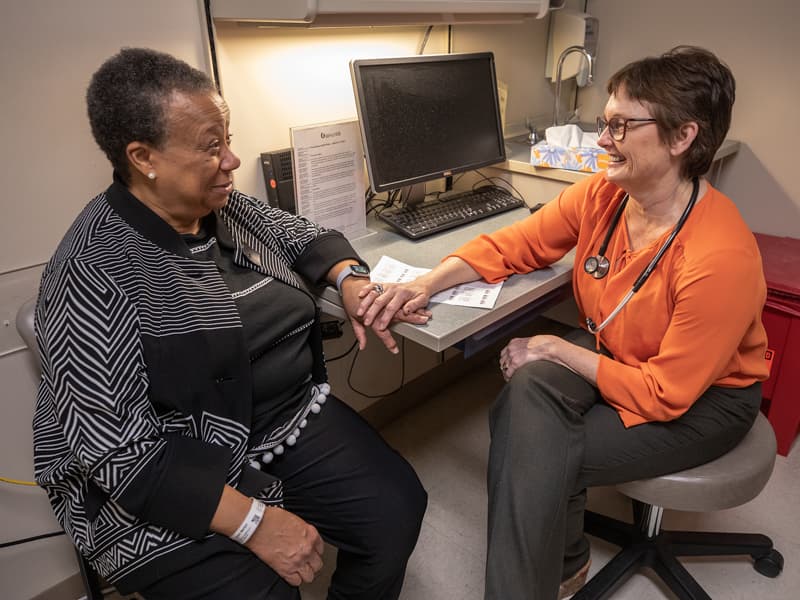 Marilyn Triplett, left, a multiple myeloma patient, talks to Dr. Stephanie Elkins, professor of hematology and oncology and head of the Division of Hematology and Oncology at the CCRI.