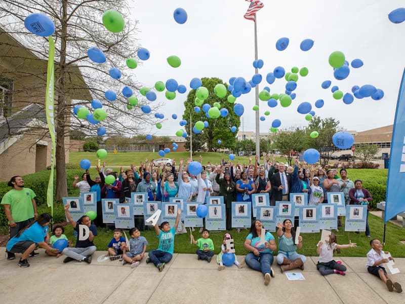 Dozens of transplant recipients and family members of organ donors gather for a balloon release at the conclusion of the Legacy Day celebration.