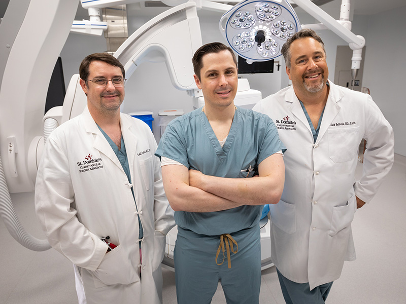 UMMC vascular surgery fellow Dr. Zachary Virgin, center, rotates at St. Dominic Hospital in Jackson. His mentors there are vascular surgeons Dr. Todd Cumbie, left, and Dr. Zachary Baldwin.