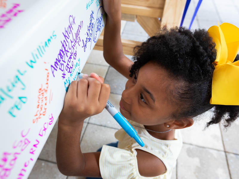 McKinley Stanton of Richland signs the beam that will go to the top of UMMC's pediatric expansion.