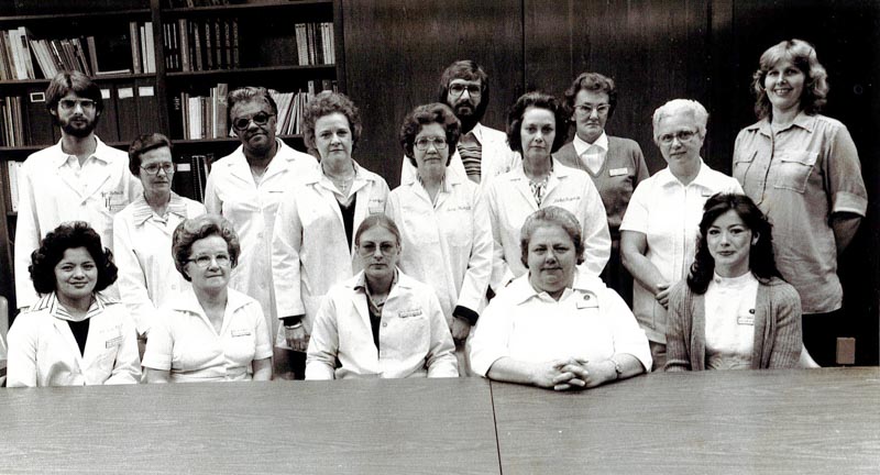 27-year-old Assistant Director of Nursing Janet Harris, front row on the far right, poses with other administrators at UMMC in the late 1970s.