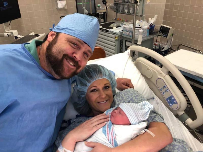 Adam and Kara McGuffee welcome their family's new member, Kade.