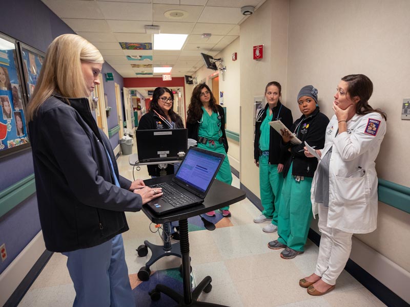 Residents conducting patient rounds.