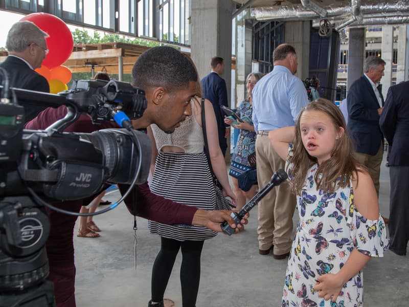 Marcus James of WJTV interviews Mississippi's 2019 Children's Miracle Network Hospitals Champion Aubrey Armstrong of Oxford before the start of the topping-out ceremony.