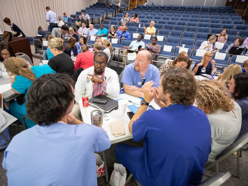 Driscoll DeVaul, center, director of respiratory and pulmonary services at Batson Children's Hospital, talks with colleagues from across Children's of Mississippi to plan the move into the expansion.