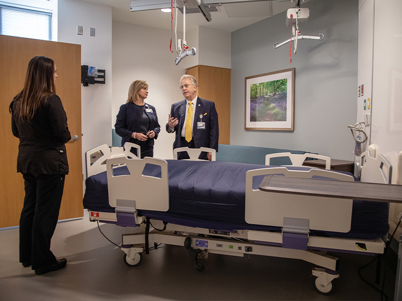 Heather Vaughn, research nurse manager for the Clinical Research and Trials Unit; Dr. LouAnn Woodward, UMMC vice chancellor for health affairs; and Dr. Gailen Marshall, medical director for the CRTU visit a patient room during the dedication of the CRTU at the University of Mississippi Medical Center.