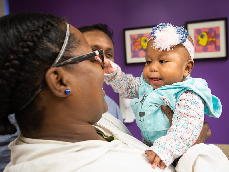 Cindy Thompson of Bassfield holds Gabbi Smith during a visit to the Children's Heart Center about a year after Gabbi's heart transplant surgery.