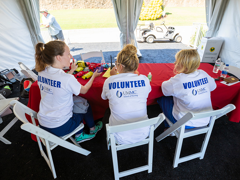 From left, Kayleigh Moore, Ashley Breeland and Chelsea Pickle, School of Nursing students, await golfers and spectators needing care at the Sanderson Farms Championship.