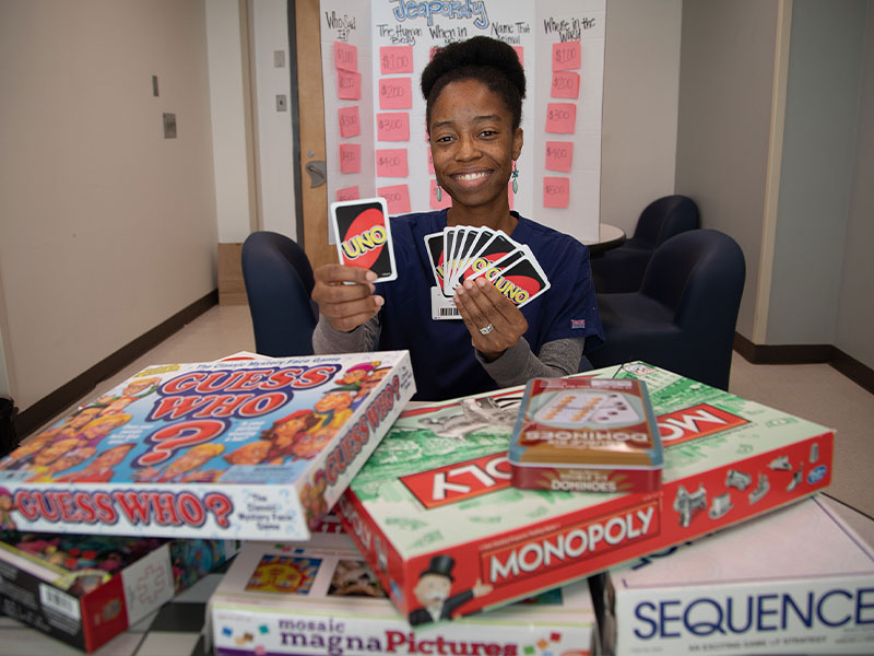 Kristy Boyd, a recreational therapist on 7 West and 7 East, uses games to stimulate patients' thinking, enjoyment of life and problem-solving skills.