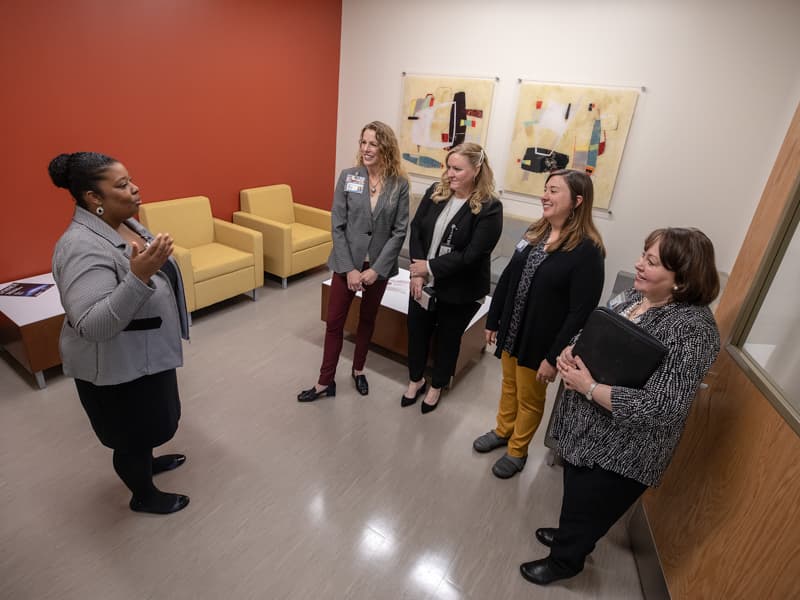 Dr. Lori Ward, left, assistant professor in the SOPH, gives a tour of the school to Dr. Jennifer Reneker, Laura Guy, Carley Dear and Dr. Mitzi Norris.