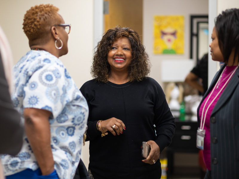 Cynthia Lewis, center, a UMMC cancer patient, shares a laugh with Janice Johnson, left, and Cassie King.