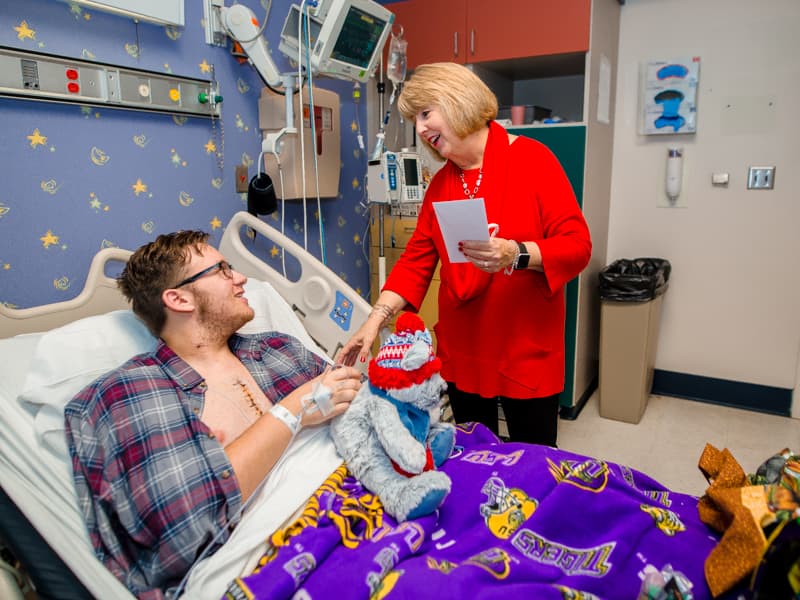 First Lady Deborah Bryant surprises Children's of Mississippi patient Cooper Williams of Woodville Monday.