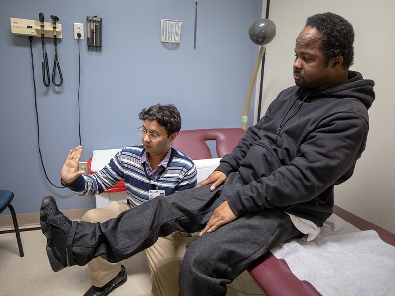 Dr. Saurabh Shukla tests Michael Jordan's reflexes and leg strength.